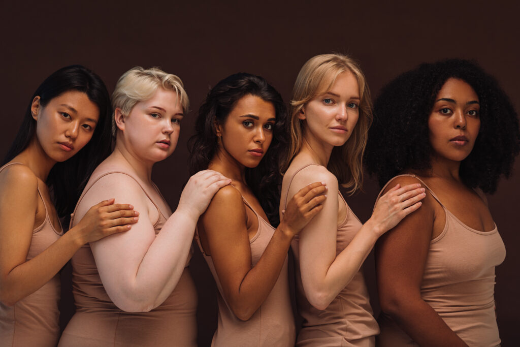 A group of women standing next to each other.